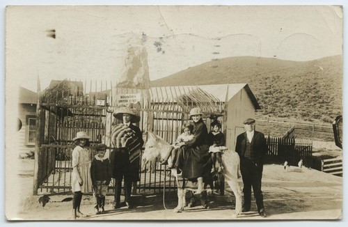 Family with donkey at U.S.-Mexico border monument