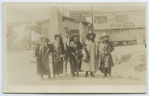 Tourists in Mexican costume near U.S.-Mexico border station