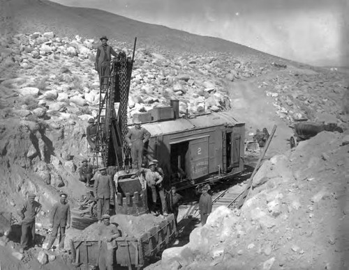 Steam shovel and labor crew