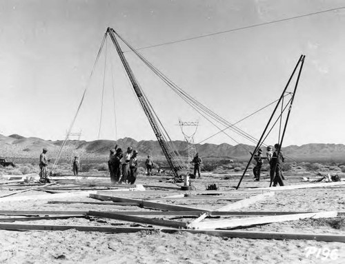 Setting up a gin pole at tower site number 43 south, Silver Lake section