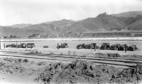 Cars damaged by flood waters from dynamiting of Los Angeles Aqueduct