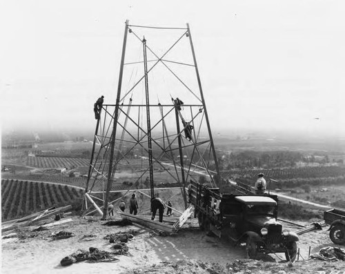 Construction scene during erection of first double-circuit Boulder Canyon transmission line tower