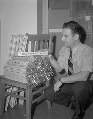 Jack Laxineta with some of the hundreds of keys for unlocking control points on street lighting circuits