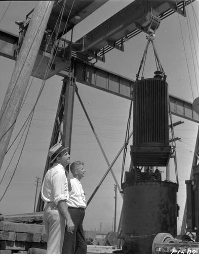 W. A. Bennett on left and Carl Udell, of Design and Construction Divison -watching crane tests