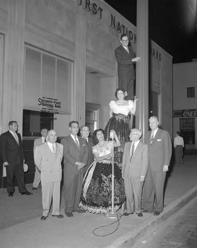 100,000th street light is turned on by Mayor Norris Poulson at the spot where the city’s first electric street light was installed in 1882