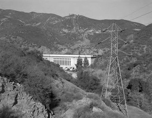 View of Power Plant 1 with transmission tower in foreground