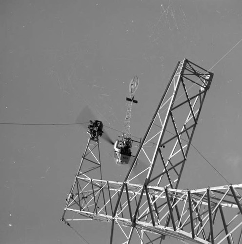 Helicopter stringing cable on the intertie line north of power plant 1