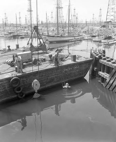 Laying a 'U' shaped pipe across the channel