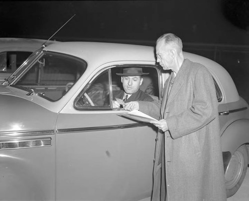 W. R. Foster volunteer guard checking in E. W. Werk at mobilization point