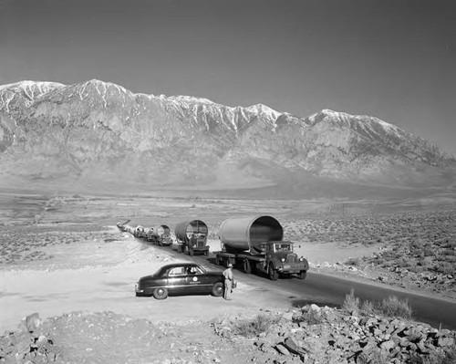 DWP trucks hauling section of penstocks to the Gorge project