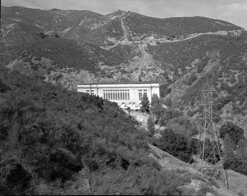 View of Power Plant 1 with transmission tower in foreground