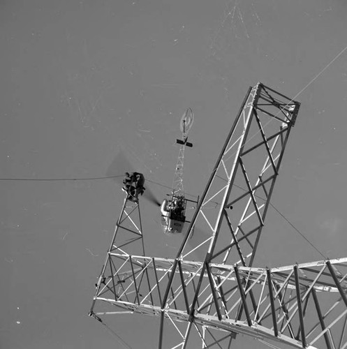 Helicopter stringing wire on the interetie line north of Power Plant 1