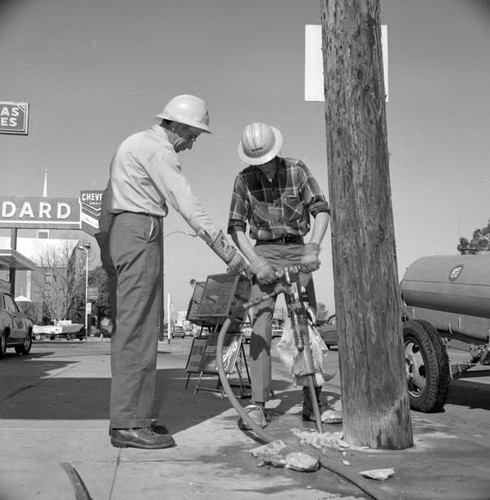 Jackhammer breaks sidewalk to remove pole at Ventura Blvd