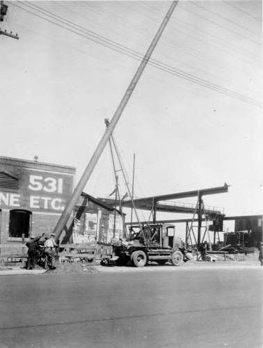 Early equipment used to set power poles