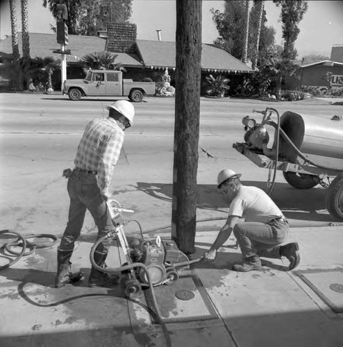 Concrete is cut so pole maybe removed at Ventura Blvd