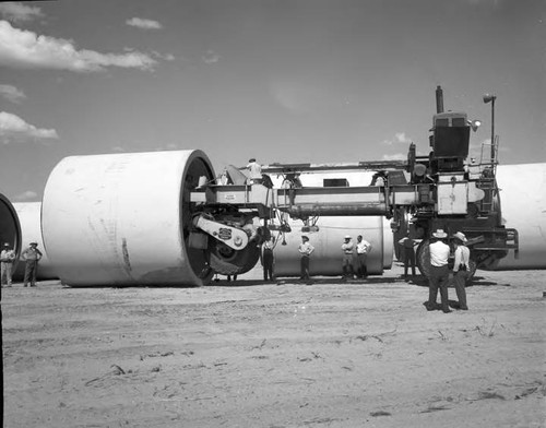 Machine designed to carry and place huge concrete pipes in place