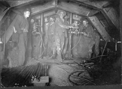 Miners and equipment used in tunnel drilling