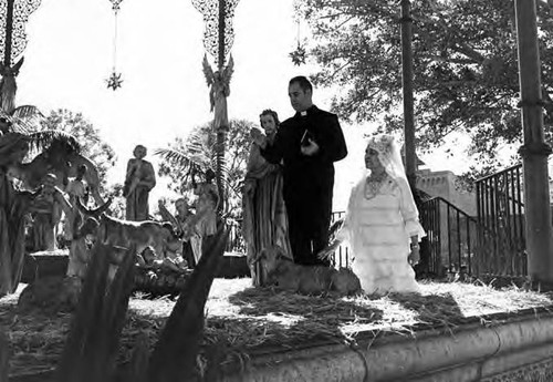 Nativity scene in kiosko; Consuelo de Bonzo and Father of Catholic Church