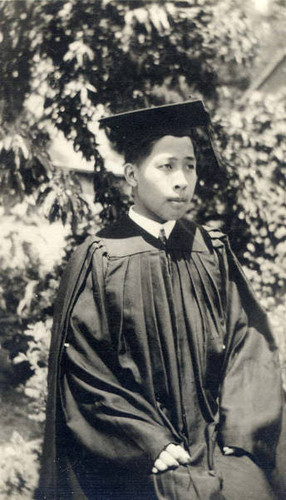 Photo of a graduate in cap and gown