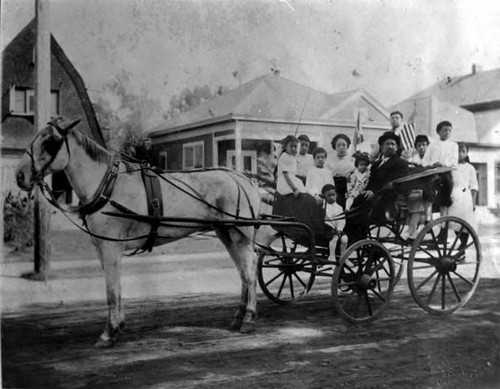 Picture of Tom Shee Bin, wife, and family. From right to left: Harriet,--, Ora, Sun, Tom Second from left: Gerald First on left: Gladys