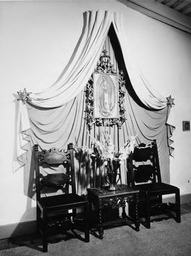 Chairs under Guadalupe in Avila Adobe