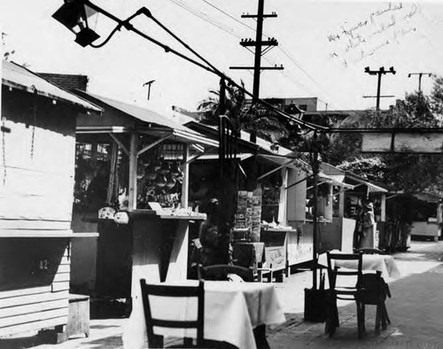 Photograph of booths and small dining tables outside of a cafe on Olvera Street