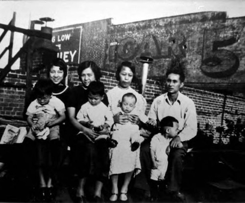 Three women, a man, three kids in Los Angeles Chinatown, Garnier complex