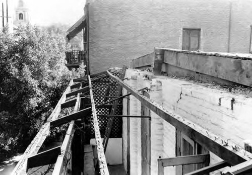 Roof over the balcony of the Pelanconi House being repaired