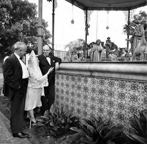 View of the nativity scene from ground with Willis Fisher, Mario Valadez, and Senara de Bonzo looking on