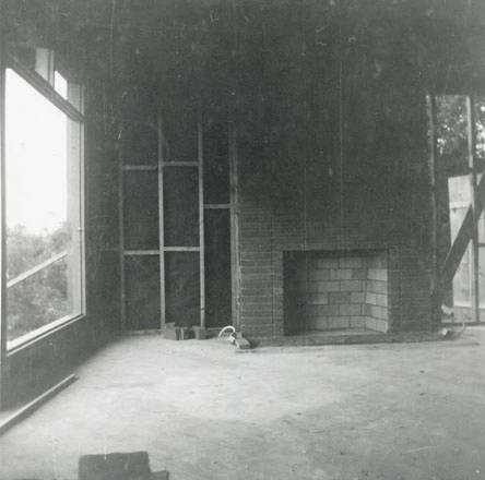 The brick fireplace and a completed window and wall (Spencer Chan Family)