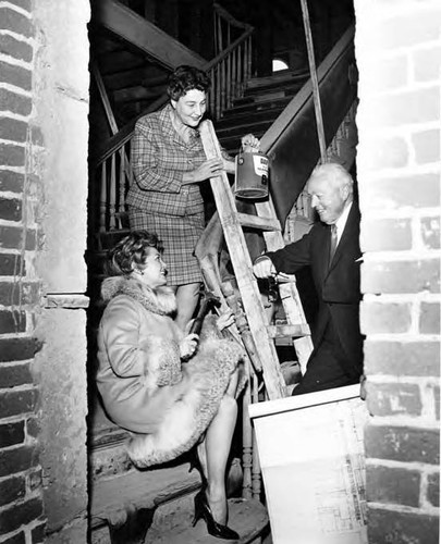 Los Amigos: Two ladies and a man posed on Pico House staircase