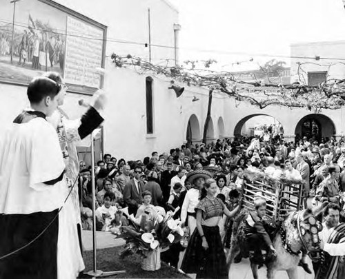 Crowd in front of priest