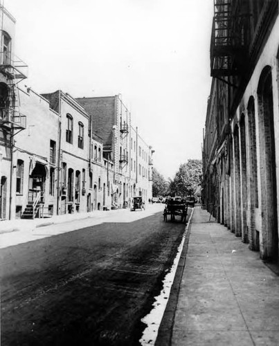 Sanchez Street looking towards Plaza, with the back of the Pico House, Merced Theater, Garnier Block and other buildings in view
