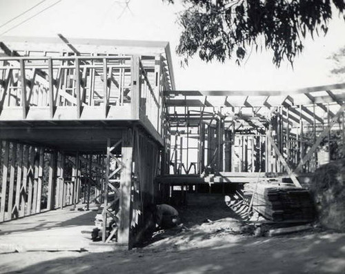 Construction site of a house. The woods frame of the house is visible, the garage is to the left (Spencer Chan Family)