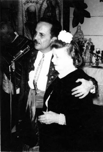 Christine Sterling with a man at the microphone