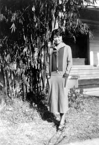 Lillie Soo Hoo standing at the backyard of the Soo Hoo's house at Pico Street