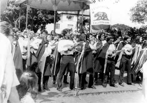 Crowds of people clebrating in the Plaza and on Olvera Street