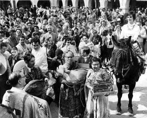 Crowd with animals in patio