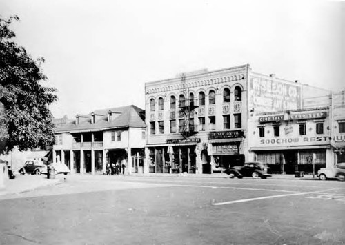 Photograph of store fronts, such as the Eastern Grocery Company, F. See On Company, and the Soo Chow Restaurant