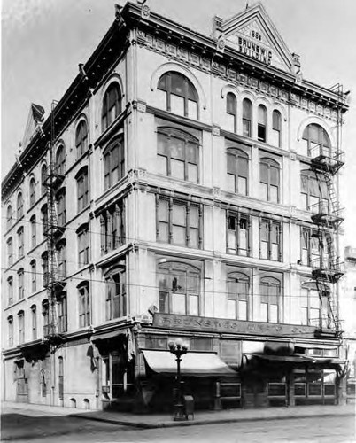 Vickrey/ Brunswig Building on Main and Republic Street. Old style street lamp and awnings in front