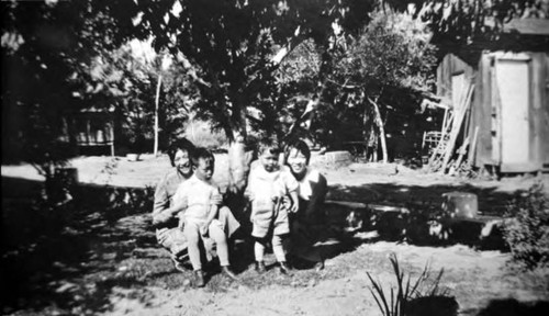 Two women and children at asparagus farm