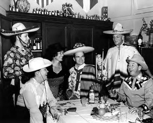 Group drinking tequila at table