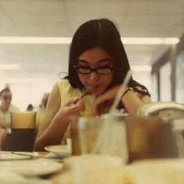 Susan Quan eating in a school cafeteria