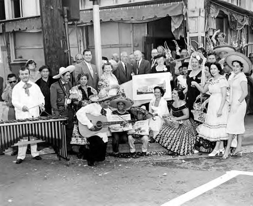 Consuelo Bonzo with a group, including Mrs. Sterling, with plans for the Simpson Building