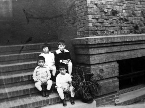 Four children on steps, 920 Sacramento