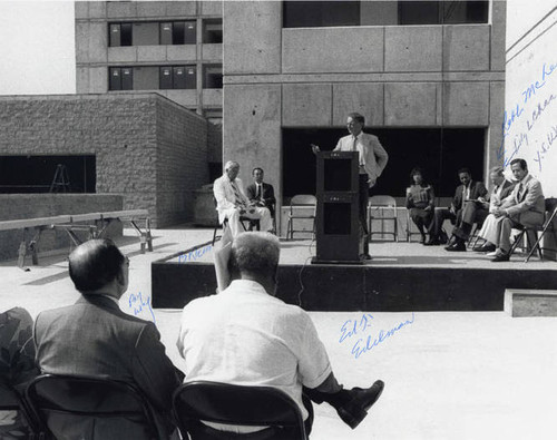 A ceremony at Cathay Manor. Ed Edelman is standing behind the podium