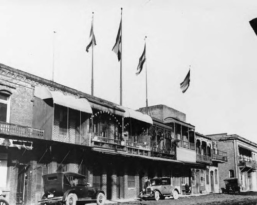 Gee How Oak Tien Association building on Apablasa Street, with three flags on the top roof