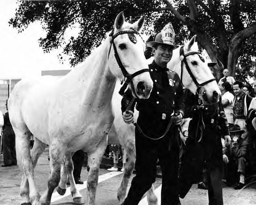 Firemen with horses in the Blessing of the Animals procession