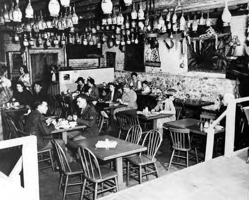 Interior of La Golondrina Cafe filled with people eating