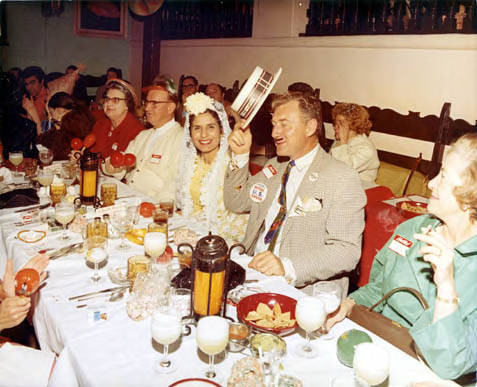 Group of people sitting at Mardi Gras dinner